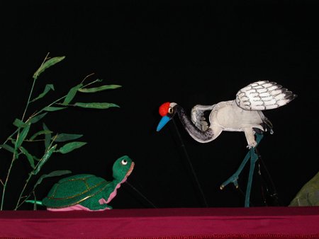 Turtle and crane puppets